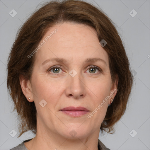 Joyful white adult female with medium  brown hair and grey eyes