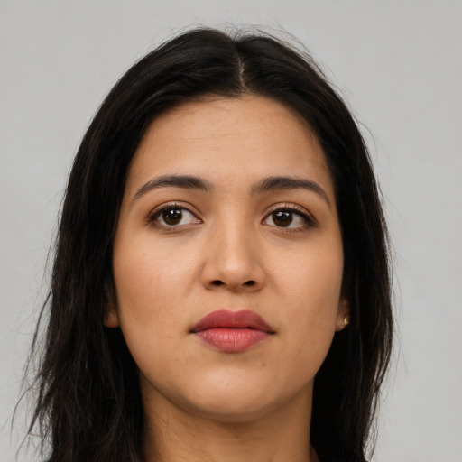 Neutral latino young-adult female with long  brown hair and brown eyes