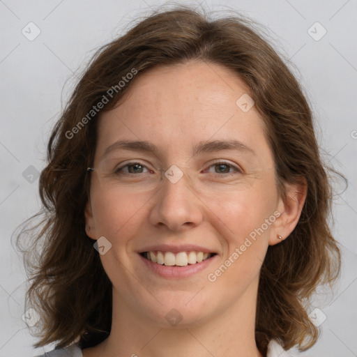 Joyful white young-adult female with medium  brown hair and green eyes