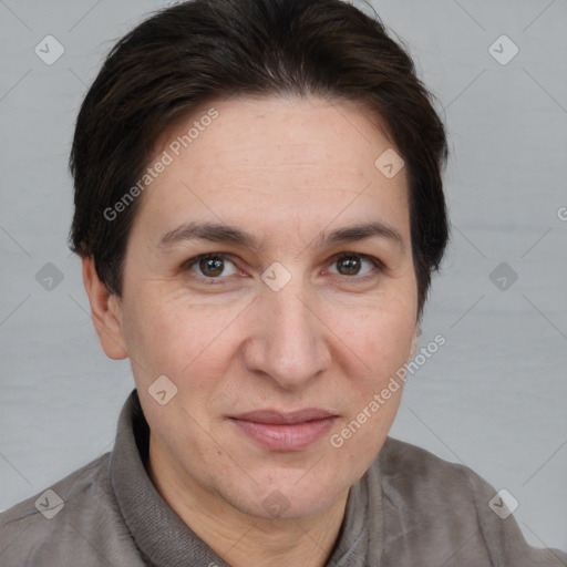 Joyful white adult female with short  brown hair and brown eyes