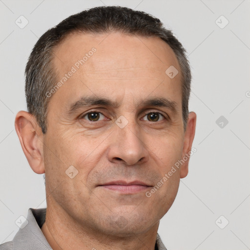 Joyful white adult male with short  brown hair and brown eyes