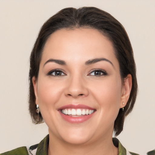 Joyful white young-adult female with medium  brown hair and brown eyes