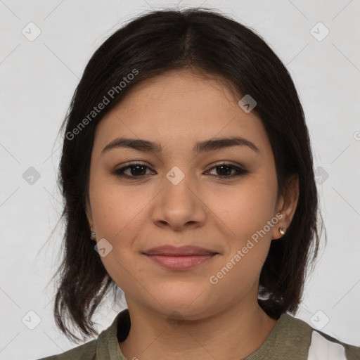 Joyful latino young-adult female with medium  brown hair and brown eyes