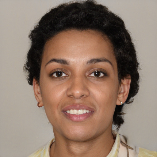 Joyful latino young-adult female with short  brown hair and brown eyes