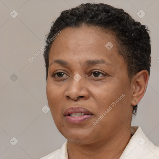 Joyful black adult female with short  brown hair and brown eyes