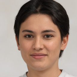 Joyful white young-adult female with short  brown hair and brown eyes