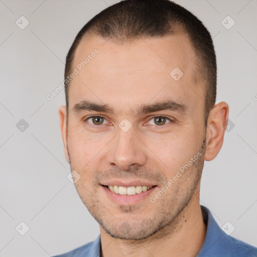 Joyful white young-adult male with short  brown hair and brown eyes