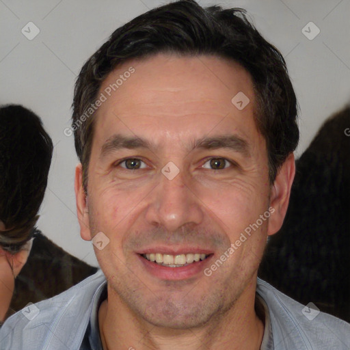 Joyful white adult male with short  brown hair and brown eyes