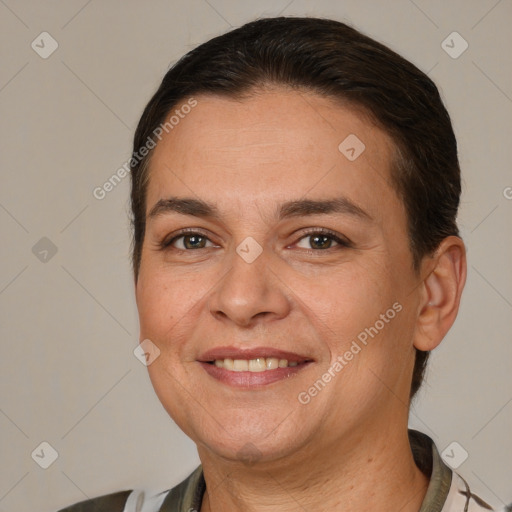 Joyful white adult female with short  brown hair and brown eyes