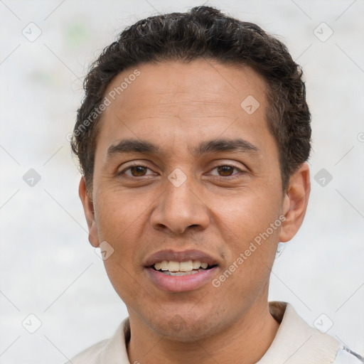 Joyful white adult male with short  brown hair and brown eyes