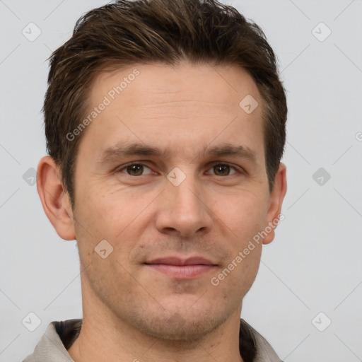 Joyful white adult male with short  brown hair and grey eyes