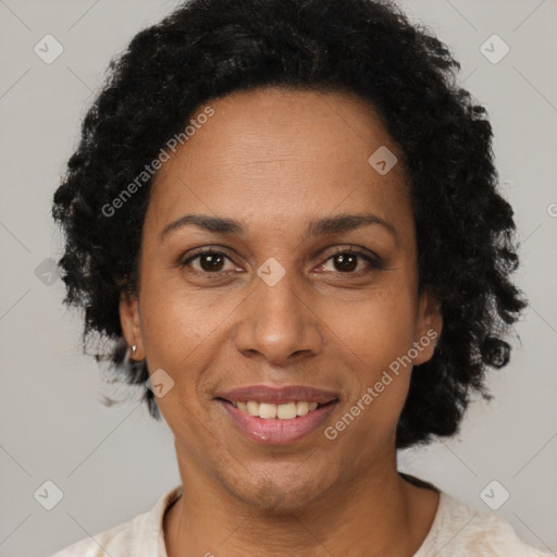 Joyful black adult female with short  brown hair and brown eyes