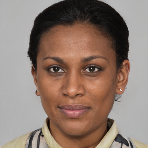 Joyful latino adult female with short  brown hair and brown eyes