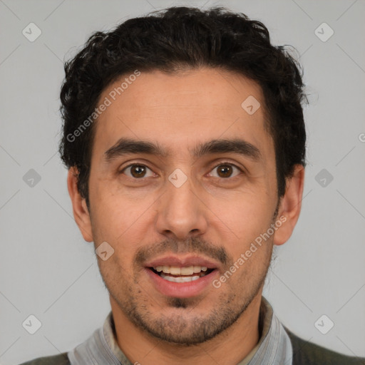 Joyful white young-adult male with short  black hair and brown eyes