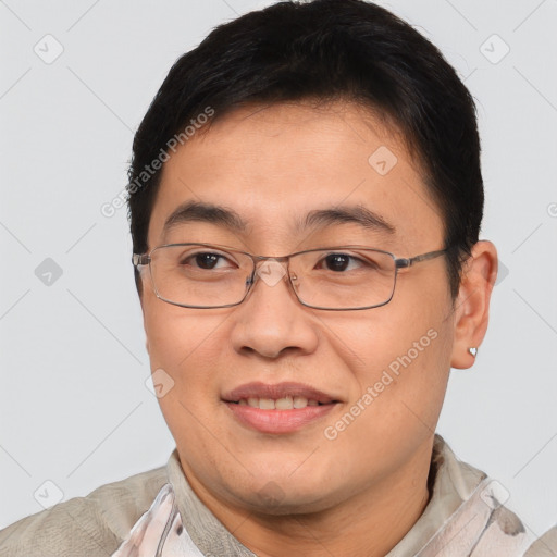 Joyful asian young-adult male with short  brown hair and brown eyes