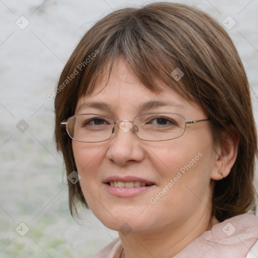 Joyful white adult female with medium  brown hair and blue eyes