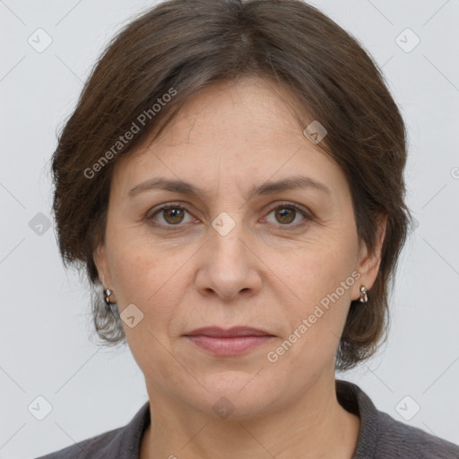 Joyful white adult female with medium  brown hair and brown eyes