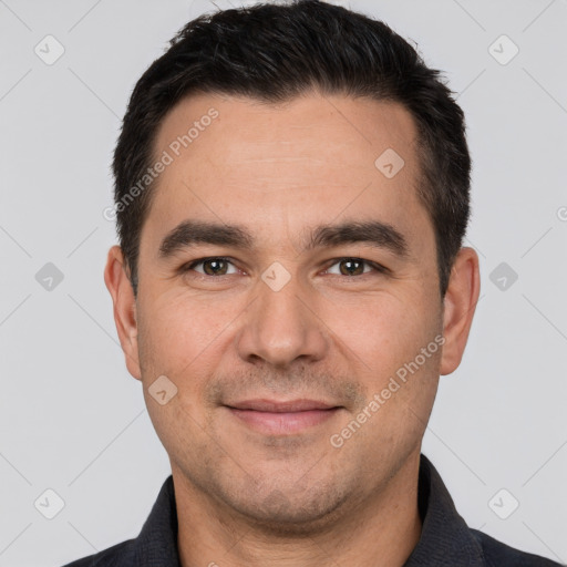 Joyful white young-adult male with short  black hair and brown eyes