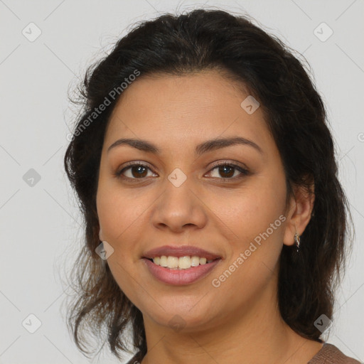 Joyful latino young-adult female with medium  brown hair and brown eyes