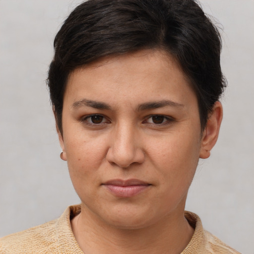 Joyful white young-adult female with short  brown hair and brown eyes