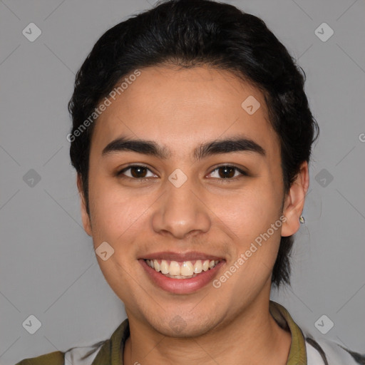 Joyful latino young-adult male with short  brown hair and brown eyes