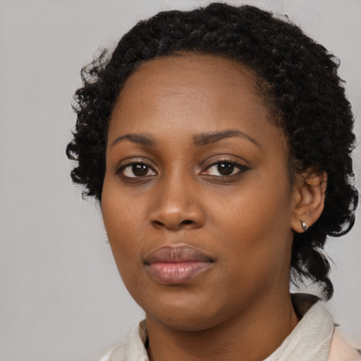 Neutral black young-adult female with long  black hair and brown eyes