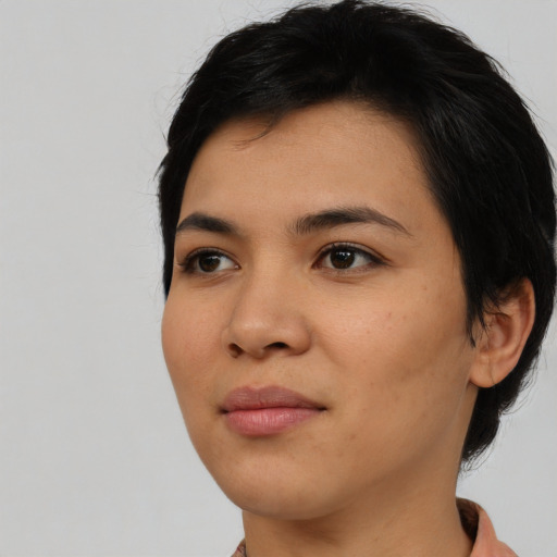 Joyful asian young-adult female with medium  black hair and brown eyes
