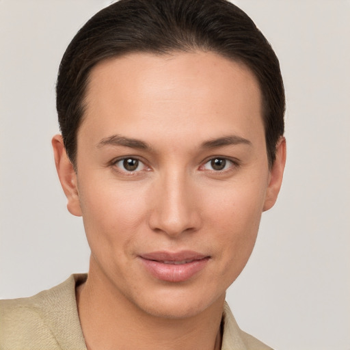 Joyful white young-adult female with short  brown hair and brown eyes