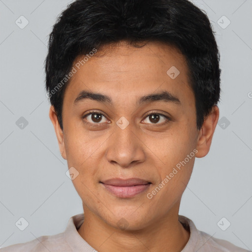 Joyful latino young-adult male with short  black hair and brown eyes