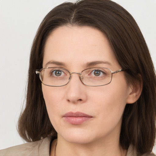 Neutral white young-adult female with long  brown hair and grey eyes