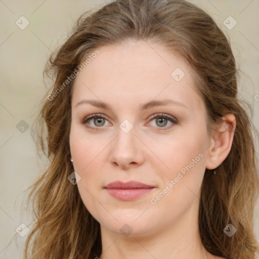 Joyful white young-adult female with long  brown hair and green eyes