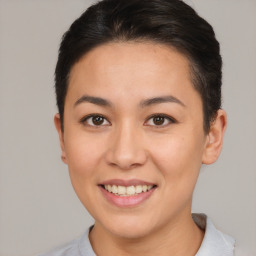 Joyful asian young-adult female with short  brown hair and brown eyes