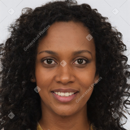 Joyful black young-adult female with long  brown hair and brown eyes