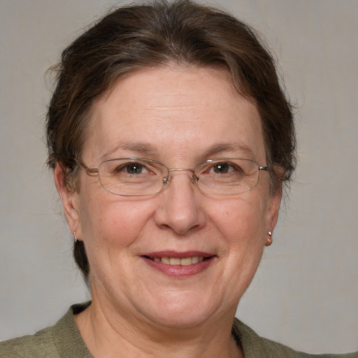 Joyful white middle-aged female with medium  brown hair and brown eyes