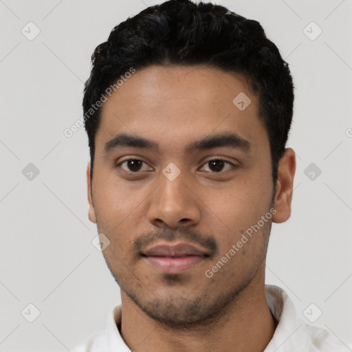 Neutral latino young-adult male with short  black hair and brown eyes