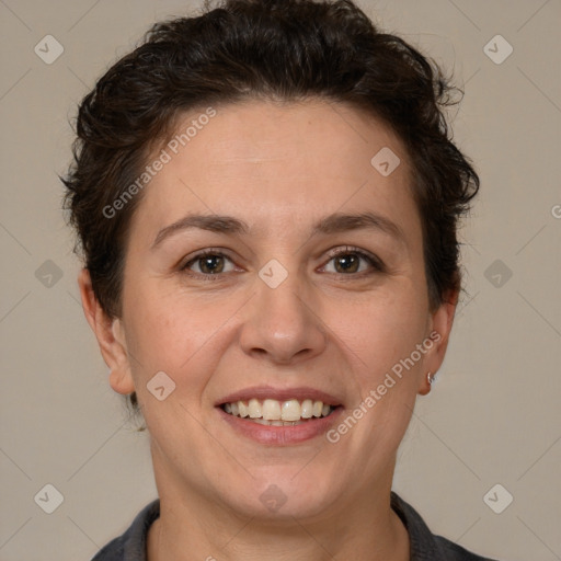 Joyful white adult female with short  brown hair and brown eyes