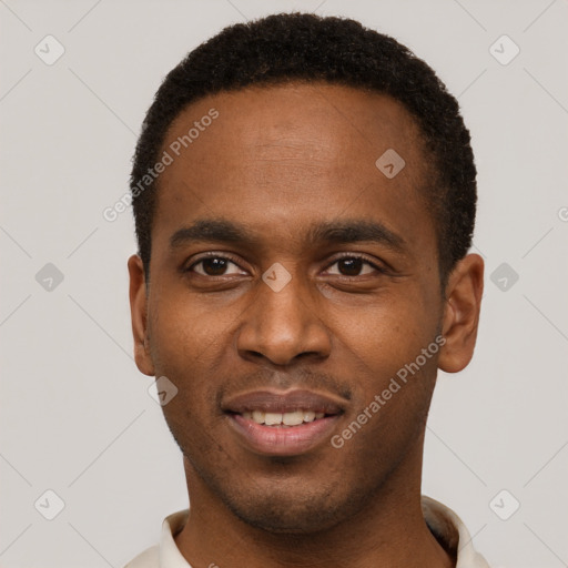 Joyful black young-adult male with short  brown hair and brown eyes