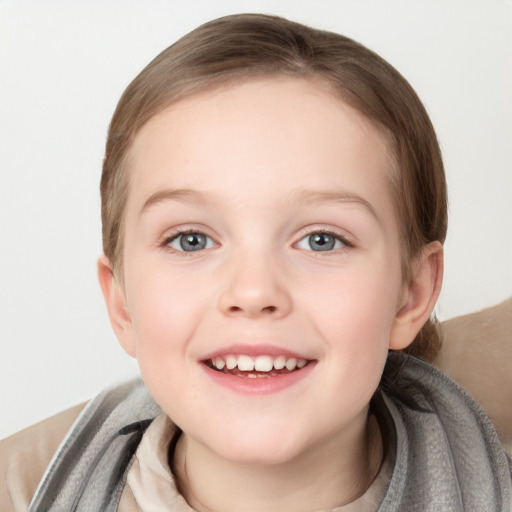 Joyful white child female with medium  brown hair and grey eyes