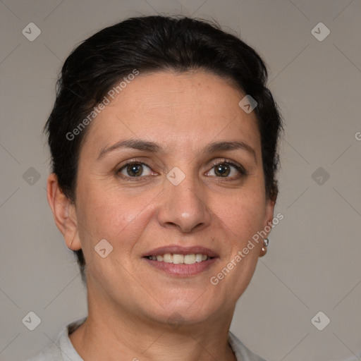 Joyful white adult female with short  brown hair and grey eyes