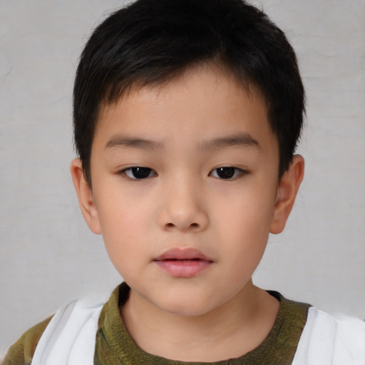 Neutral asian child male with short  brown hair and brown eyes