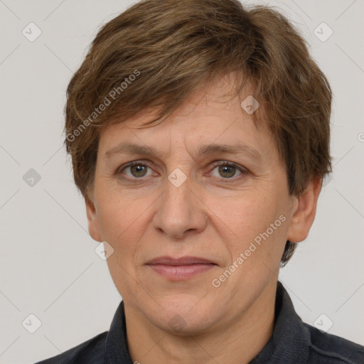 Joyful white adult female with short  brown hair and grey eyes