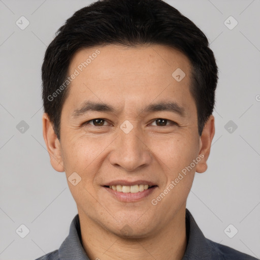 Joyful white young-adult male with short  black hair and brown eyes