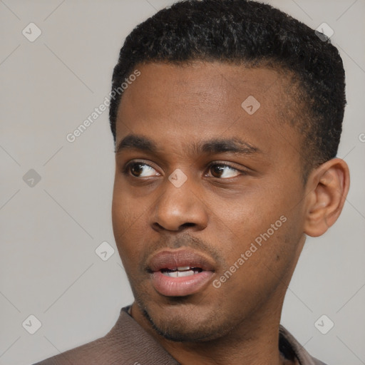Neutral black young-adult male with short  black hair and brown eyes