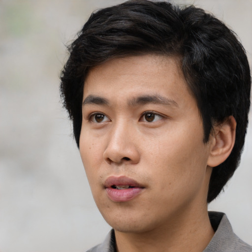 Neutral asian young-adult male with short  black hair and brown eyes