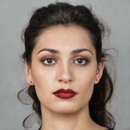 Neutral white young-adult female with long  brown hair and brown eyes