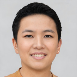 Joyful asian young-adult male with short  black hair and brown eyes