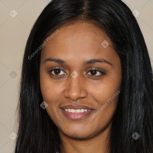 Joyful black young-adult female with long  brown hair and brown eyes