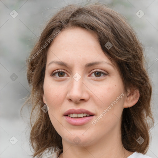 Joyful white young-adult female with medium  brown hair and green eyes