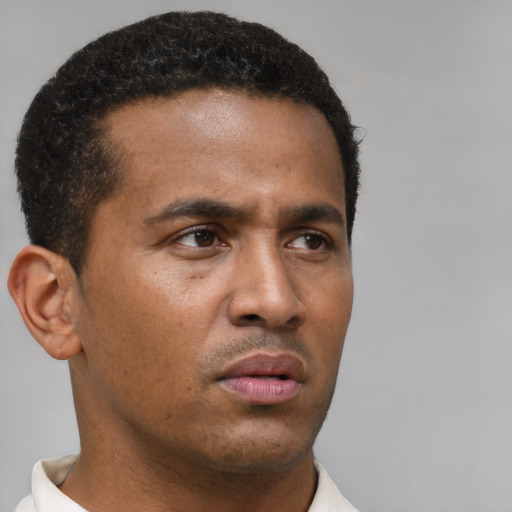 Neutral black young-adult male with short  brown hair and brown eyes