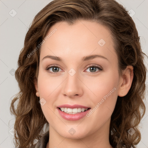 Joyful white young-adult female with long  brown hair and green eyes